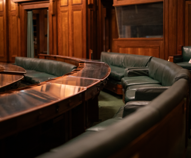 Empty chamber with tiered wooden seating